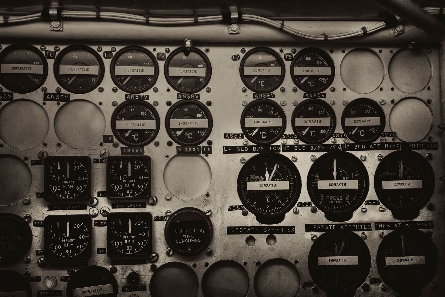 A dense cockpit instrument panel of dials and gauges